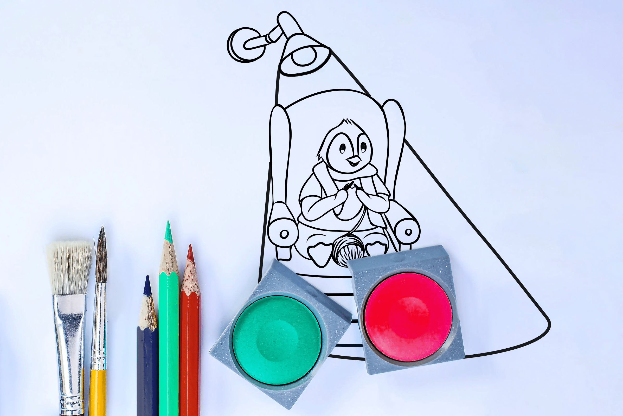 Kreativecke Maskottchen Horst sitzt auf dem Sessel und strickt